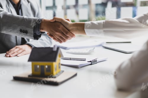 Preview: Handshake after reaching a real estate deal. Signing a house rental, mortgage, lease agreement.