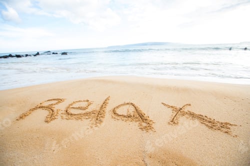 Preview: The word relax written in sand at beach