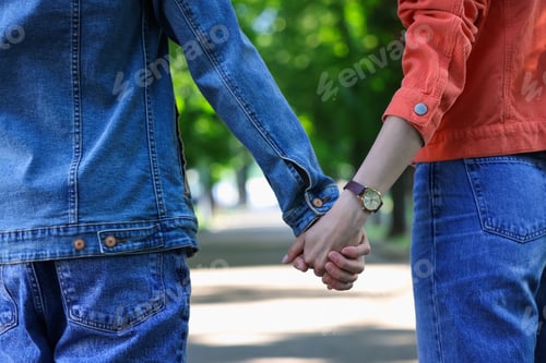 Preview: Lovely couple walking together in park, closeup