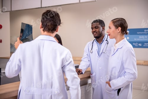 Preview: Group Of Doctor Chatting On The Ward