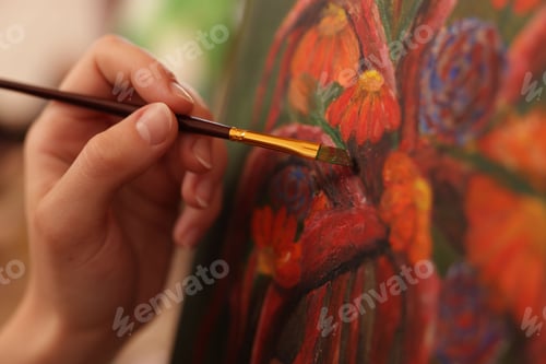 Preview: Woman learning to draw with brush on blurred background, closeup