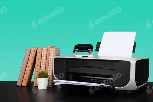 Preview: Home laser printer on desk against green background