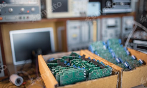 Preview: Close-up electric green embedded microcircuits in production