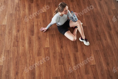 Preview: Aerial view. Sportive young woman have fitness day in the gym at morning time