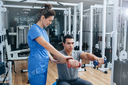 Preview: Athlete recovery after an elbow injury. Rehabilitation center for rehabilitation. Physiotherapist's