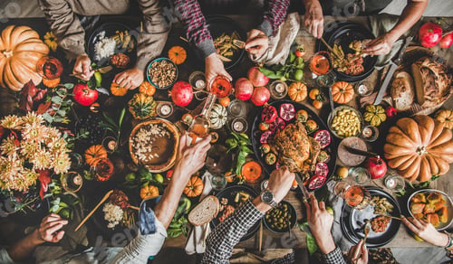 Preview: People eating and pouring wine at Thanksgiving celebration dinner table
