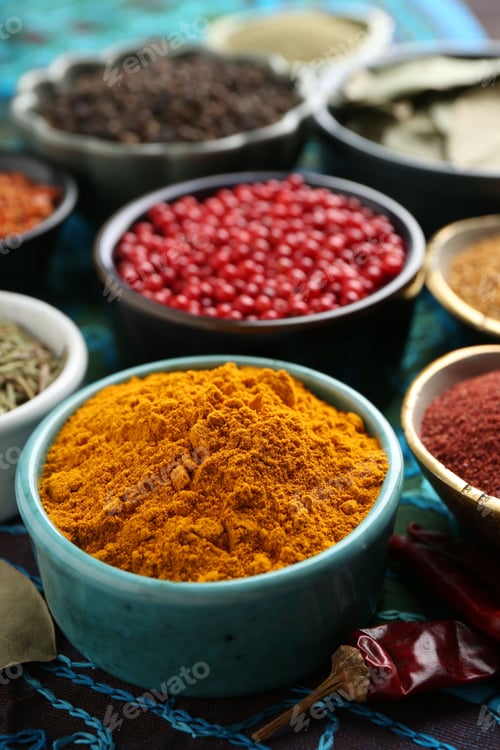 Preview: Different aromatic spices on blue tablecloth, closeup