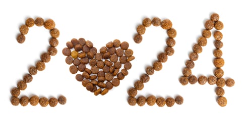 Preview: Calendar 2024 from Dry pet food and heart shape from crispy granules on a white background.