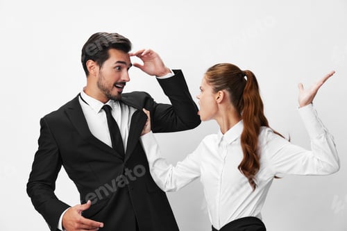 Preview: Man and woman anger business hitting on each other screaming with their hands up in the air on a