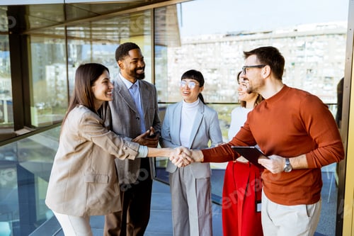 Preview: Engaging business meeting with diverse professionals exchanging ideas in a modern office setting