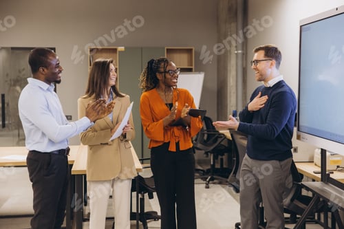 Preview: Diverse group of professionals engaging in a collaborative discussion in a modern office environment