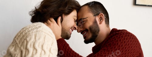 Preview: Joyful moment of a loving gay couple celebrating together at home