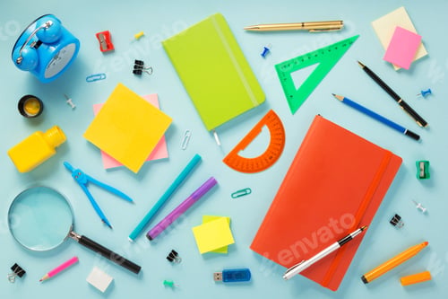 Preview: notebook and school accessories at abstract background
