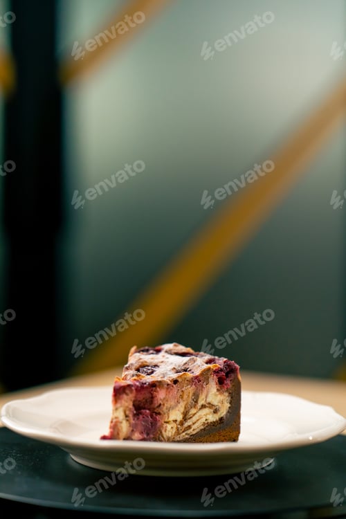 Preview: A dessert close-up of a piece of delicious cake lying on a white plate in an Italian restaurant