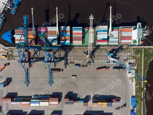 Preview: Aerial view of a container ship being loaded and unloaded at container terminal freight port