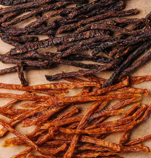 Preview: Beef and chiken jerky on wooden board