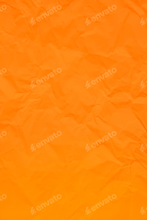 Preview: Orange crumpled wrinkled textured paper background.