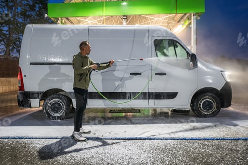 Preview: Man Pressure Washing and Cleaning White Van