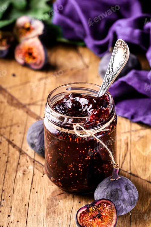 Preview: Fig confiture in glass jar. Fresh fruits on wooden kitchen table, negative space