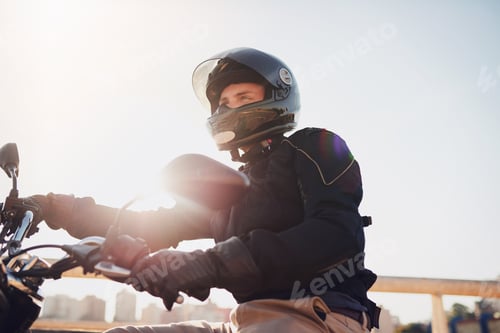 Preview: Its just you and the road. Shot of a young man riding a motorbike through the city.