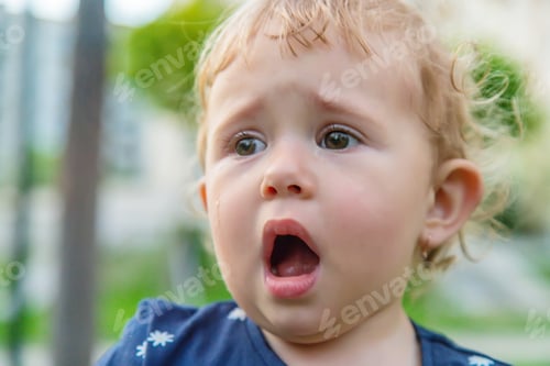 Preview: Baby crying in the park. Selective focus.
