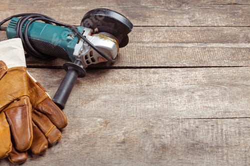 Preview: Grinder and Gloves on Weathered Wooden Workbench