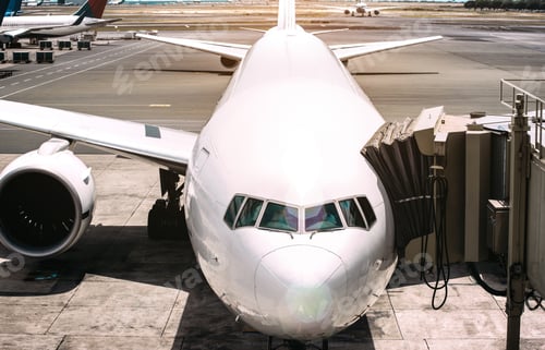Preview: Front view of airplane near airport runway ready to takeoff