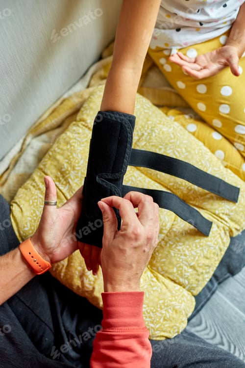 Preview: Physical Therapist Fitting a Support Brace on a Young Girls Arm