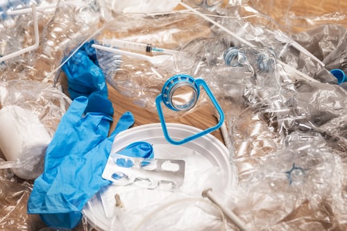 Preview: Pile of different plastic waste on wooden surface