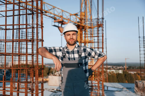 Preview: Front view of man that is working on the construction site at daytime