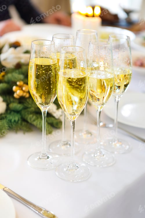 Preview: Champagne into a glasses standing on the Christmas table