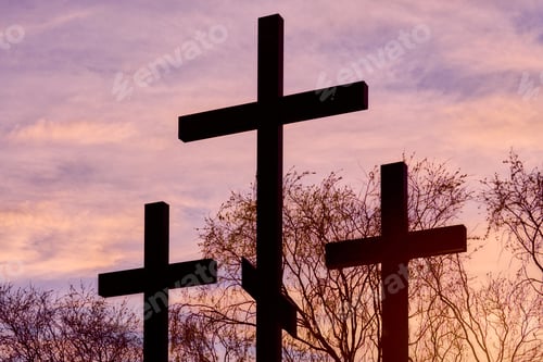 Preview: Three crosses in silhouette at sunset, dramatic sky