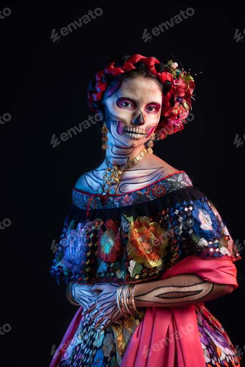 Preview: Latina woman dressed as a Mexican Catrina, with bold skull makeup