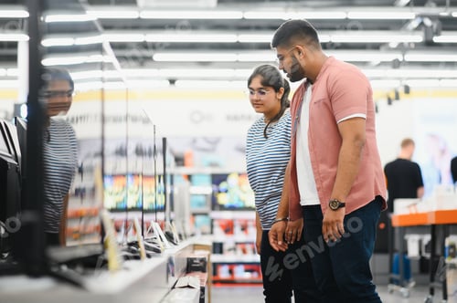 Preview: Couple in shopping. They are looking for new tv