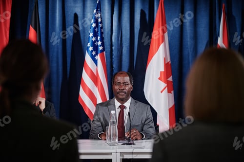 Preview: Political representative sitting at conference