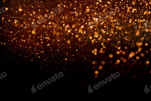 Preview: Beautiful, sparkling orange glitter pouring down from above on a dark background