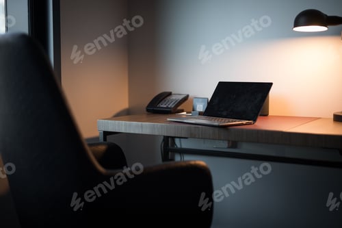 Preview: Laptop on the table with phone in the modern office