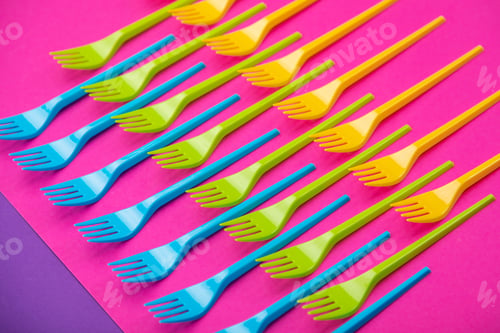 Preview: Many color plastic forks on a bright background