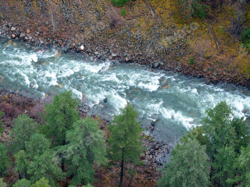 Preview: Aerial View Of Turbulent River Winding Through Rocky Banks And Forest In British Columbia, Canada