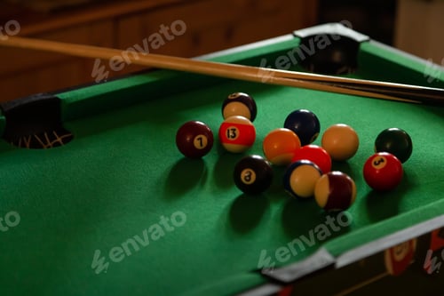 Preview: Light and shadow. Pool table in a dark room with balls and cue.
Game.