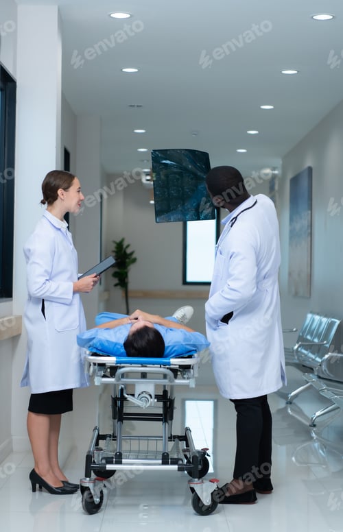 Preview: Medical teacher and interns see brain x-ray results of a patient