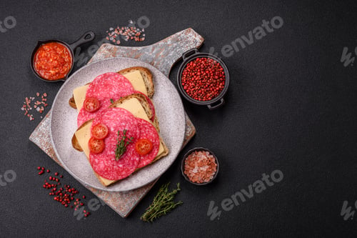Preview: Sandwich with toast, salami slices, cheese and tomatoes, salt and spices