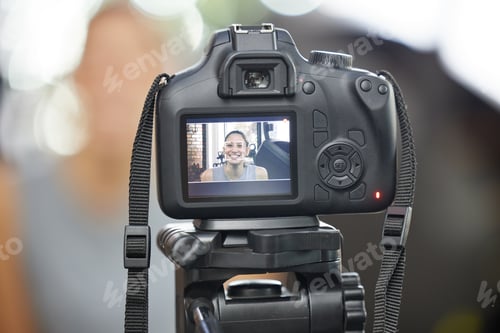 Preview: Have a vision. Shot of a young woman using a camera to record for her vlog in a gym.