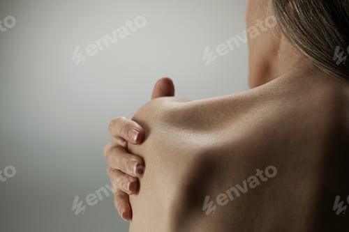 Preview: Topless senior woman, rear view