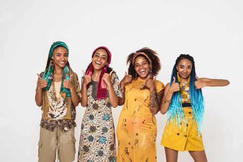 Preview: Young black four women wearing dress laughing while showing thumbs up