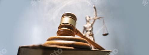 Preview: Judge gavel on a sound block and the statue of lady justice on the background - concept of law