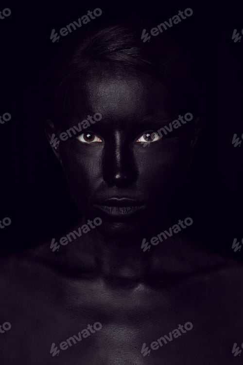 Preview: fashionable portrait of a woman in black paint with sequins on her face. open eyes