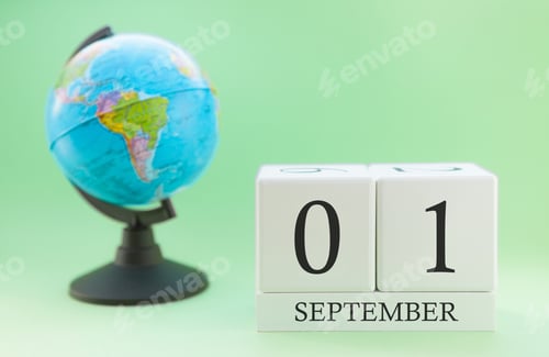 Preview: Calendar made of wood on a light green background, 01 day of the month September, autumn 1st day