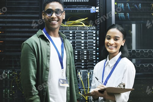 Preview: No virus, no problem. Shot of two technicians working together in a server room.
