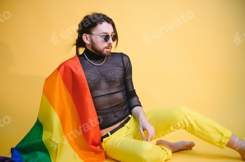 Preview: Handsome young man with pride movement LGBT Rainbow flag